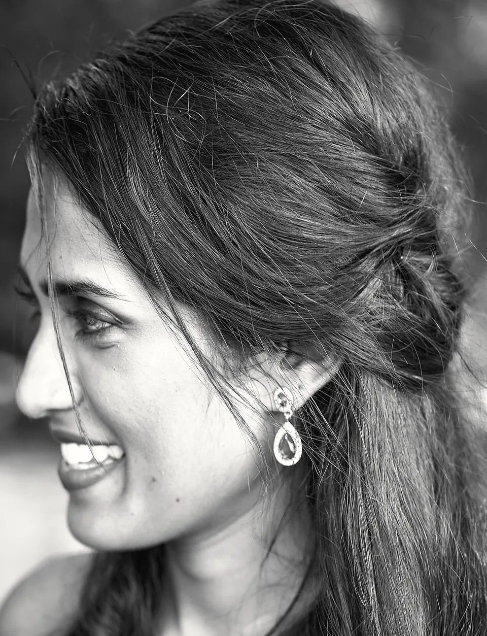 Anu laughing, in black and white