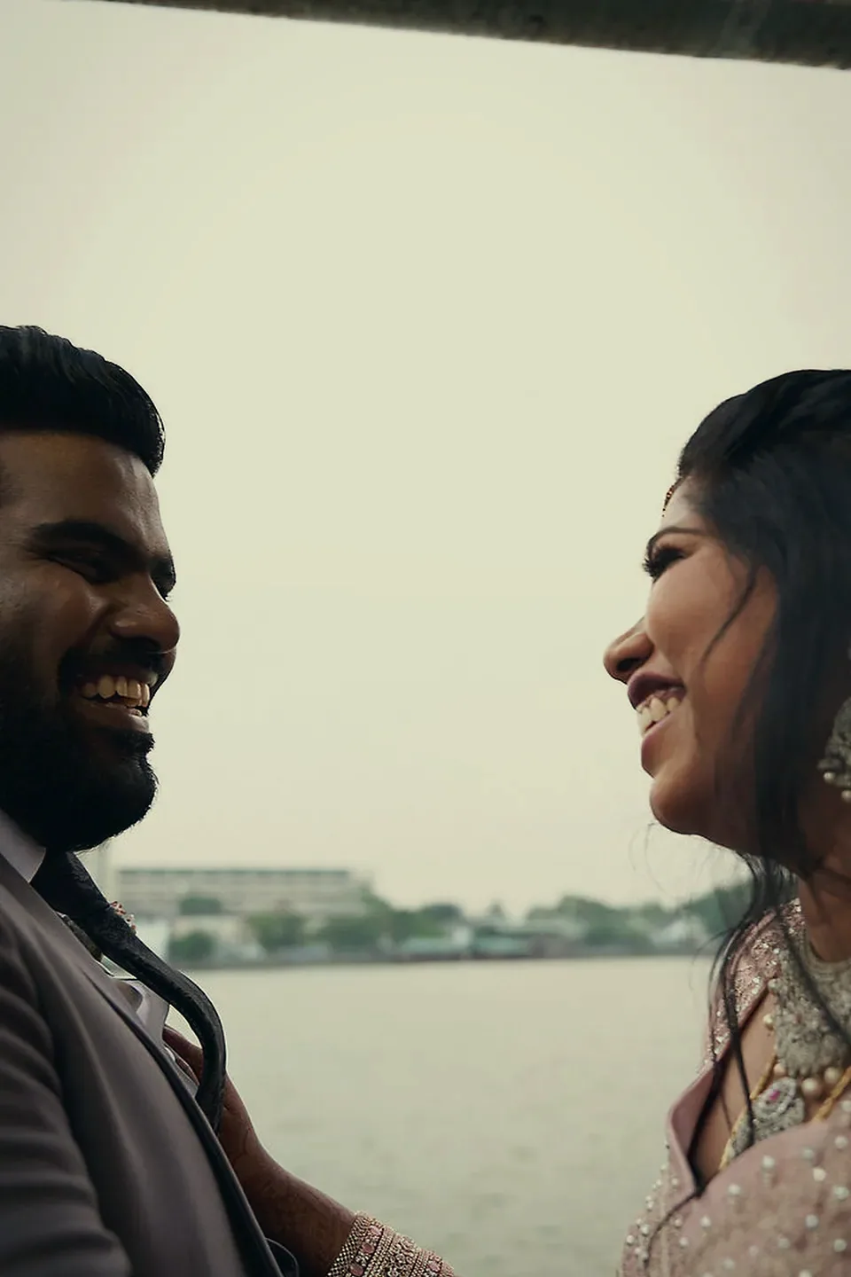 Suweda smiling over Dishon's shoulder